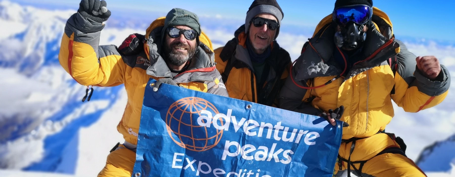 Expedition members climbing a mountain
