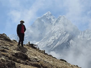 Yogi on the ridge above Dingboche